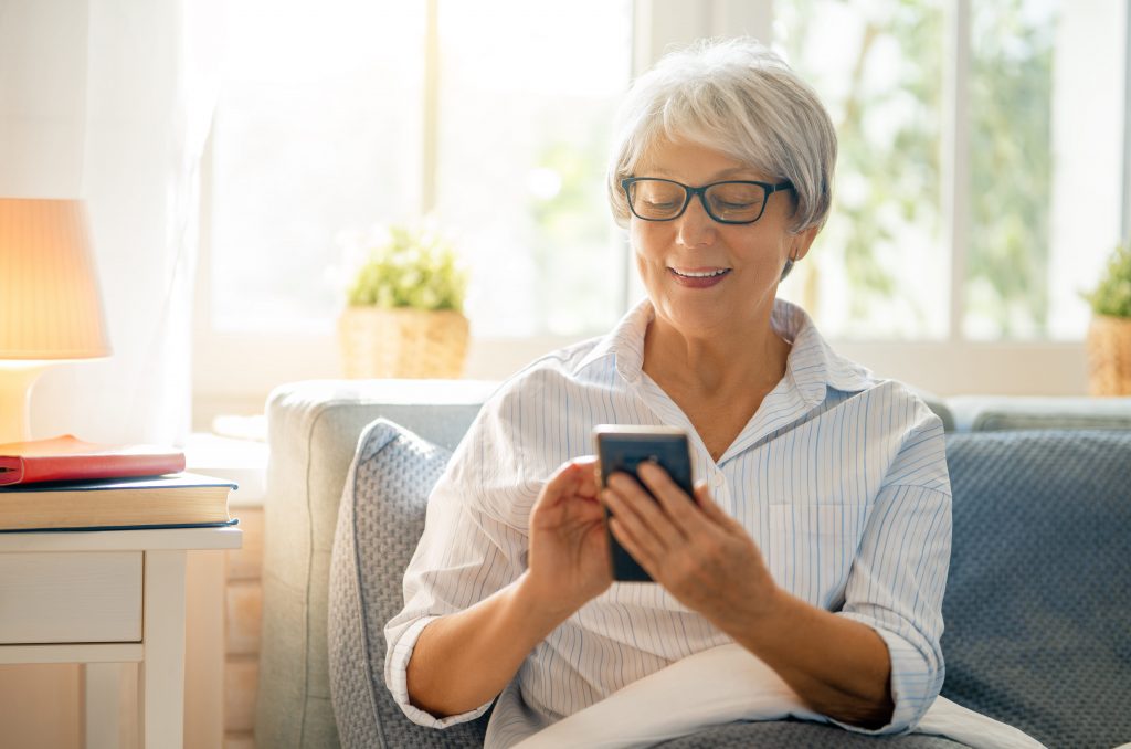 Elderly woman using a smartphone.