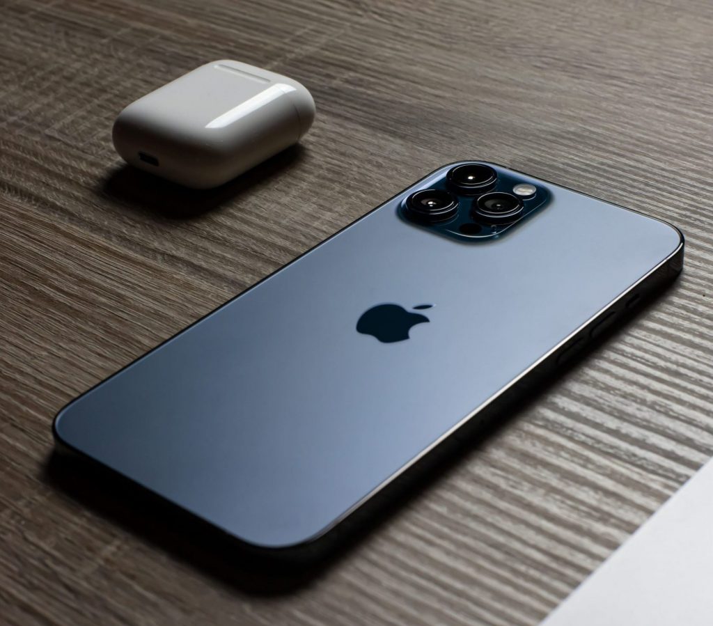 Apple iPhone 11 Pro with Apple AirPods.