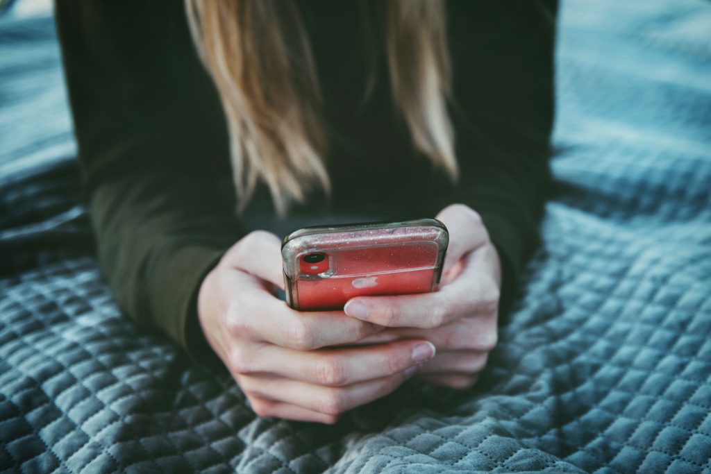 Woman browsing the web on a phone.